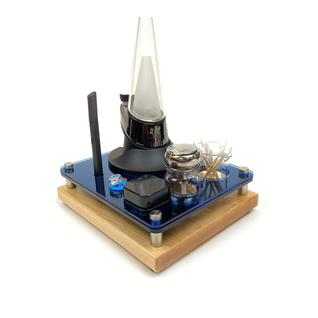 Decorative item with glass components on a wooden base against a white background